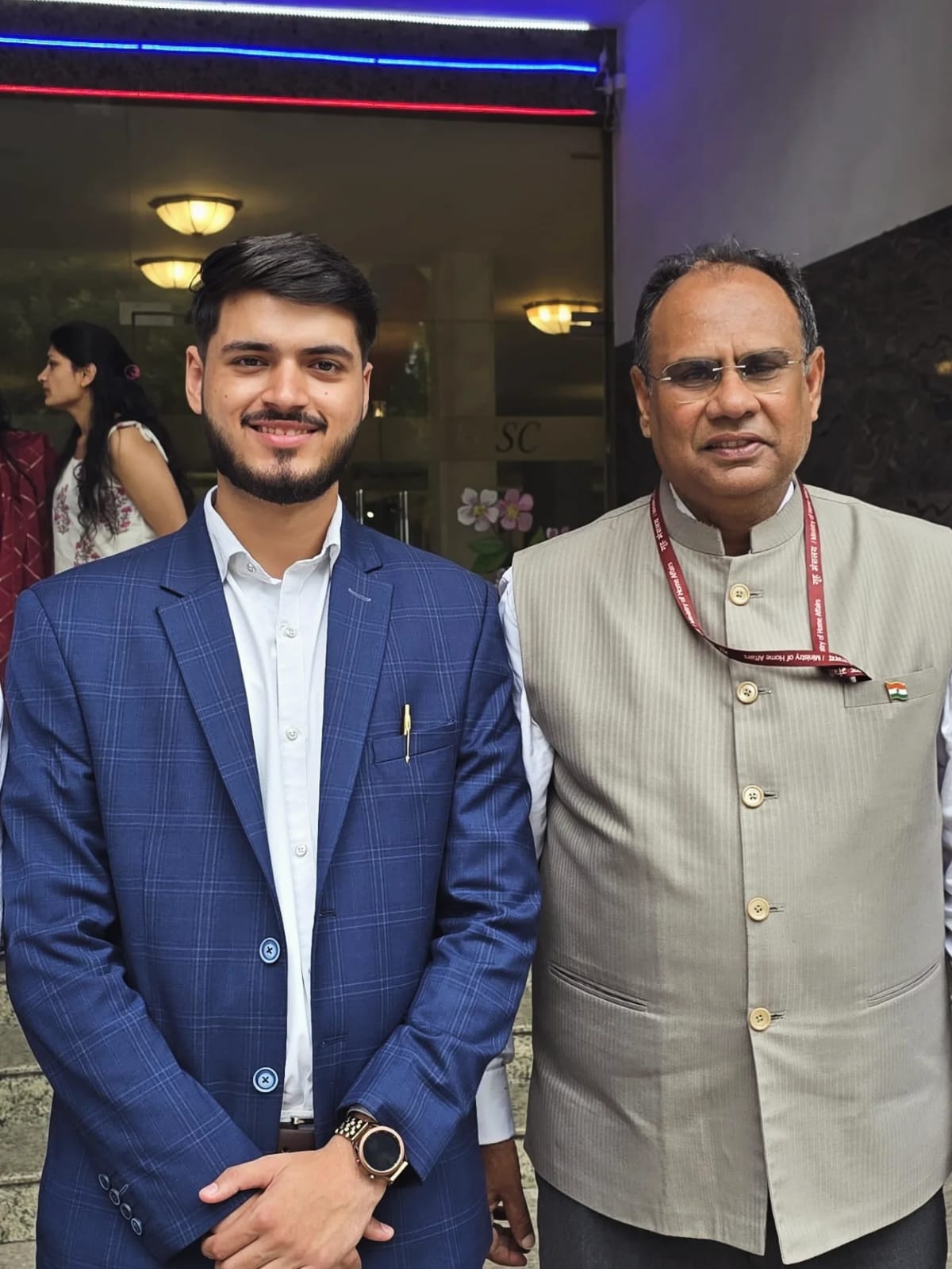 Akshat Mehrotra standing with the Ambassador of Russia.